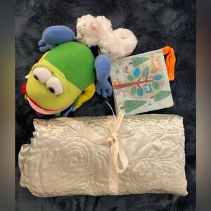 Bundle of a new baby blanket in shiny light green, two interactive baby books